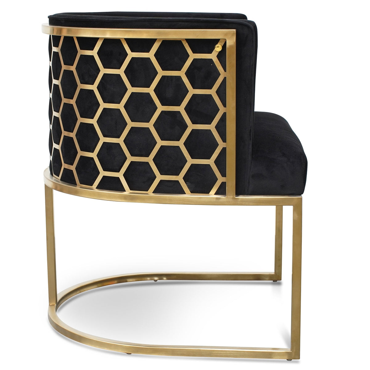 Side view of Kate lounge chair in black velvet with brushed gold armrests and blue steel sofa core – luxurious and modern interior design
