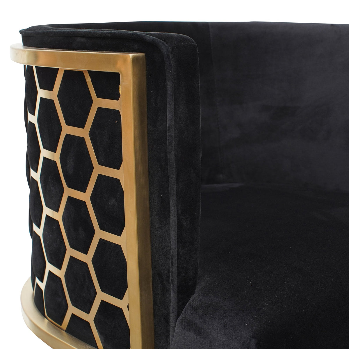 Side detail view of Kate lounge chair in black velvet with brushed gold armrests and blue steel sofa core – showcasing premium materials and refined craftsmanship