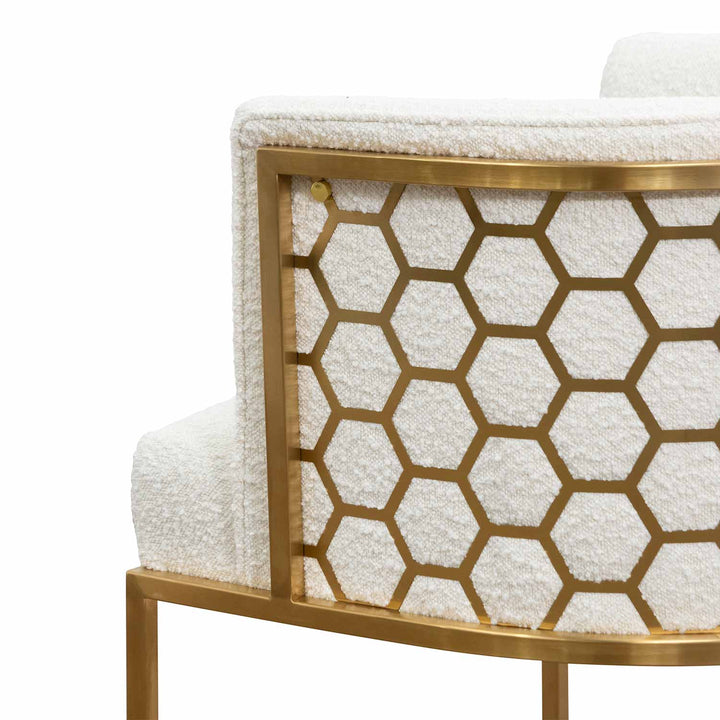Side view of Kate white velvet lounge chair with black velvet seat, brushed gold armrests, and blue steel sofa core – modern luxury with refined elegance