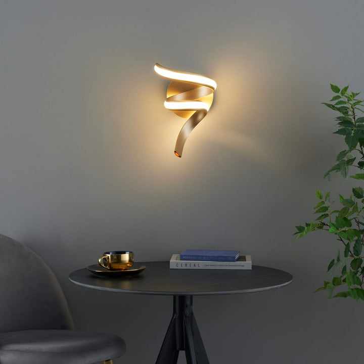 Close-up detail of Lara golden spiral LED wall sconce light by Lux Decor Australia