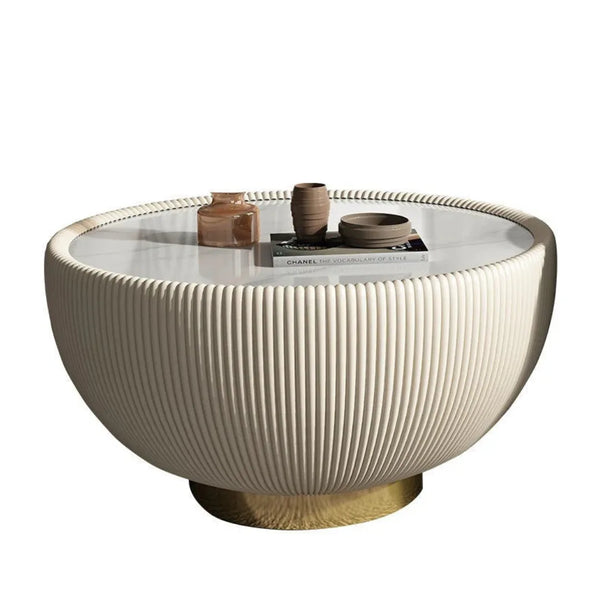 Large drum coffee table featuring modern round design and elegant textured finish