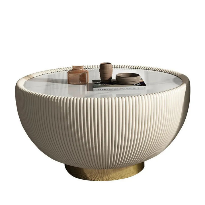 Large drum coffee table featuring modern round design and elegant textured finish