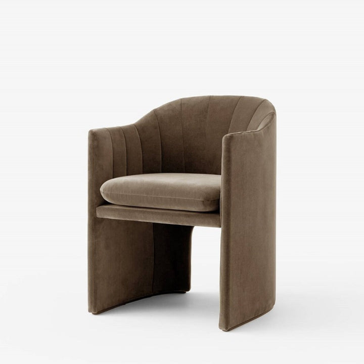 Side view of Loafer dining chair with custom upholstery, highlighting sleek modern design and cushioned seat