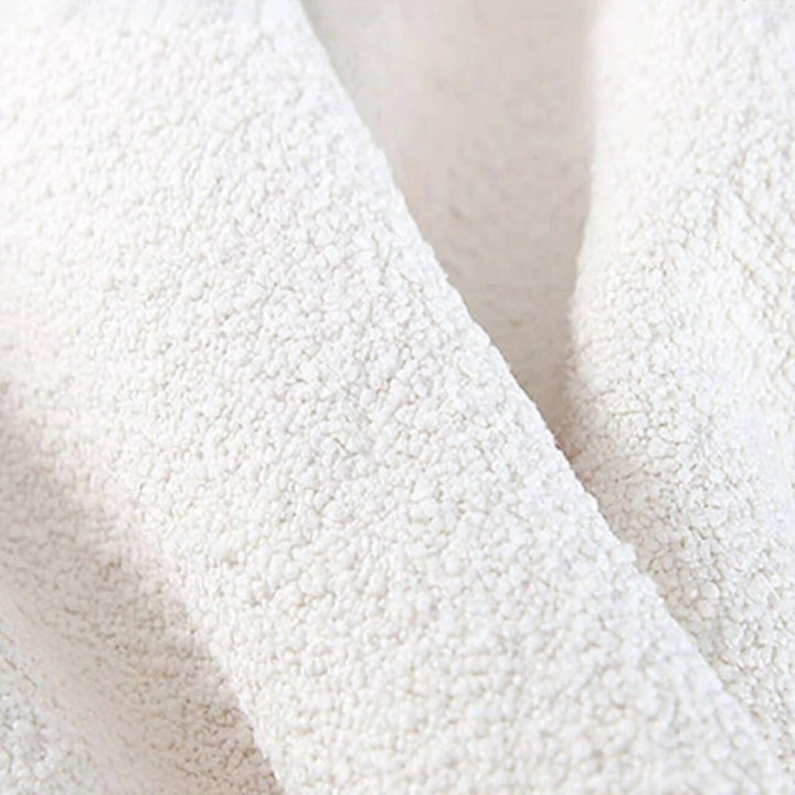 Close-up of Luma Cloud sofa upholstery showcasing soft fiber texture and detailed fabric weave