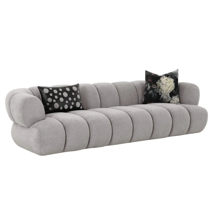 Front view of Luma Cloud sofa showcasing plush cushions and modern design in neutral tones.