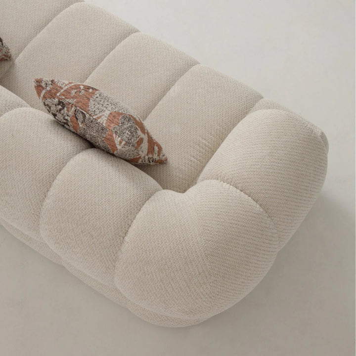 Close-up of Luma Cloud sofa upper curve highlighting smooth lines and elegant design