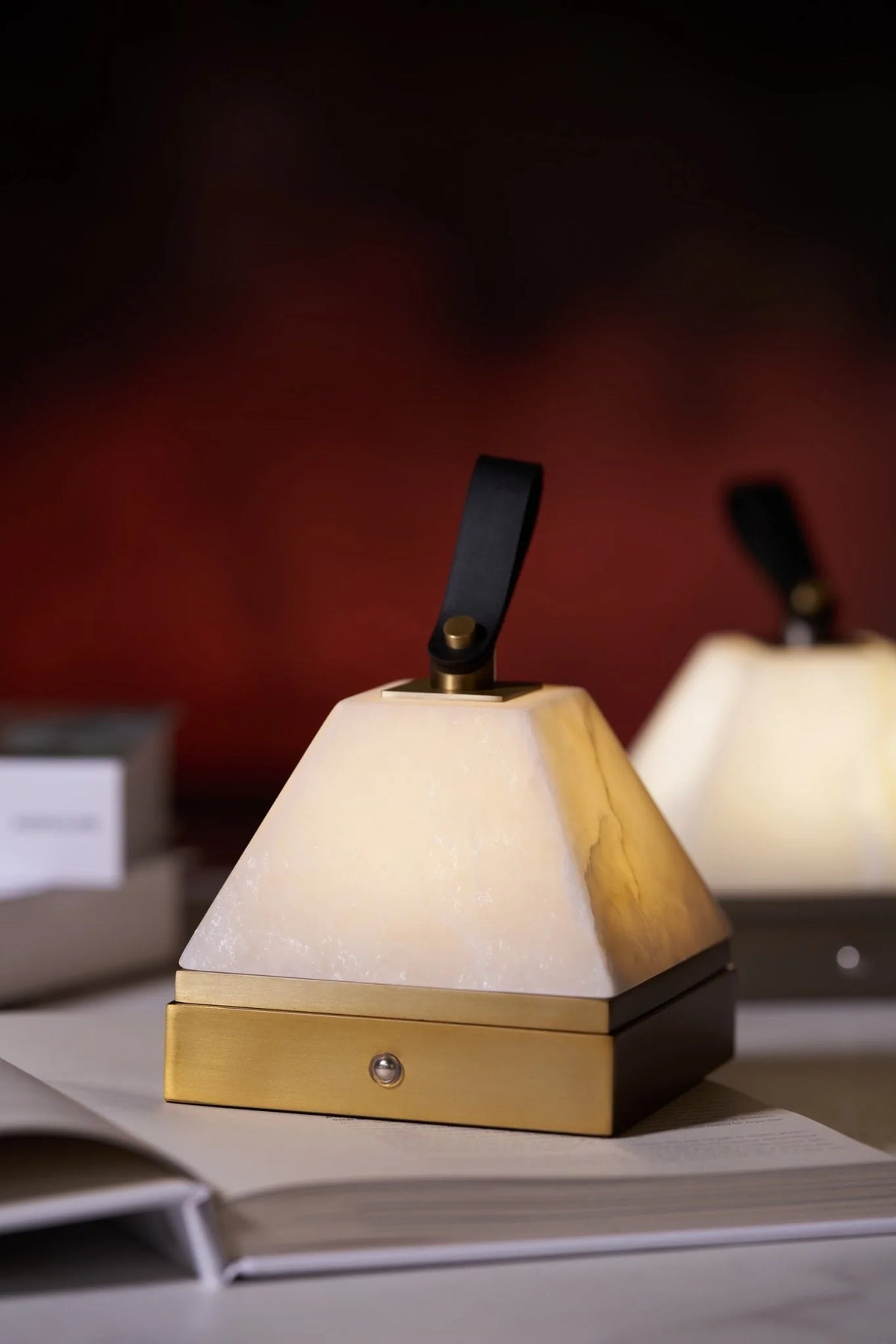 Luma cube portable lamp side view featuring modern cube design with soft warm glow, rechargeable light