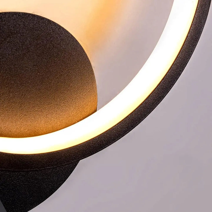 Detail view of Lumen Ring wall light showing its modern circular design and refined finish