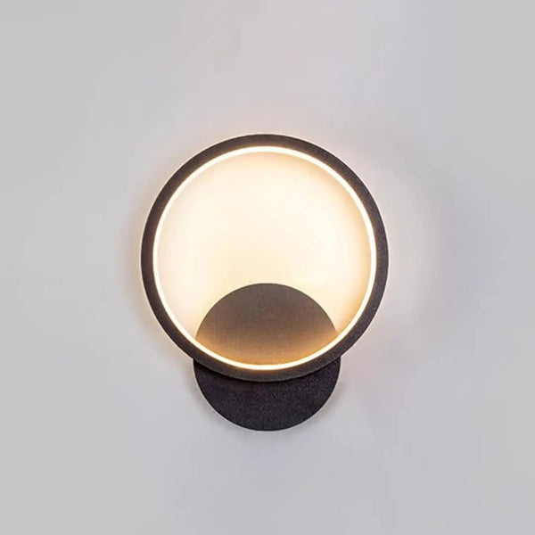 Front view of modern Lumen Ring wall light with sleek circular design for contemporary interiors.