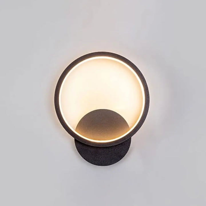 Front view of modern Lumen Ring wall light with sleek circular design for contemporary interiors.