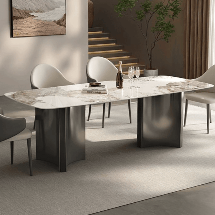 Close-up of Lumina dining table 180cm featuring smooth marble top and polished stainless steel base