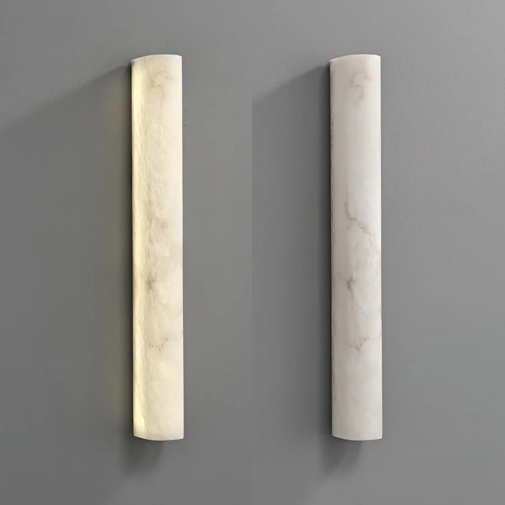 Luminara alabaster wall sconce illuminated, showcasing luxury and elegant home lighting