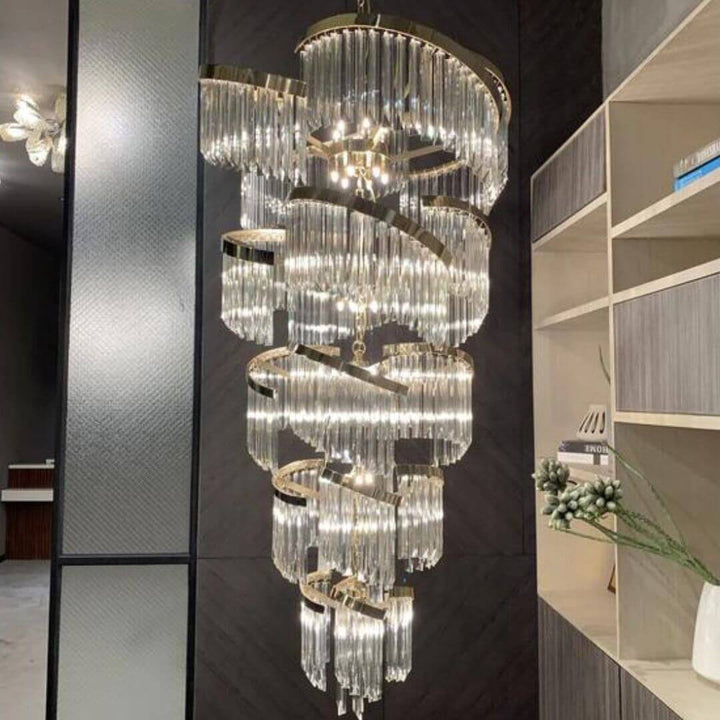 Luminary Glass Chandelier Light turned on, casting a warm, ambient glow through elegant glass shades, perfect for modern living spaces.