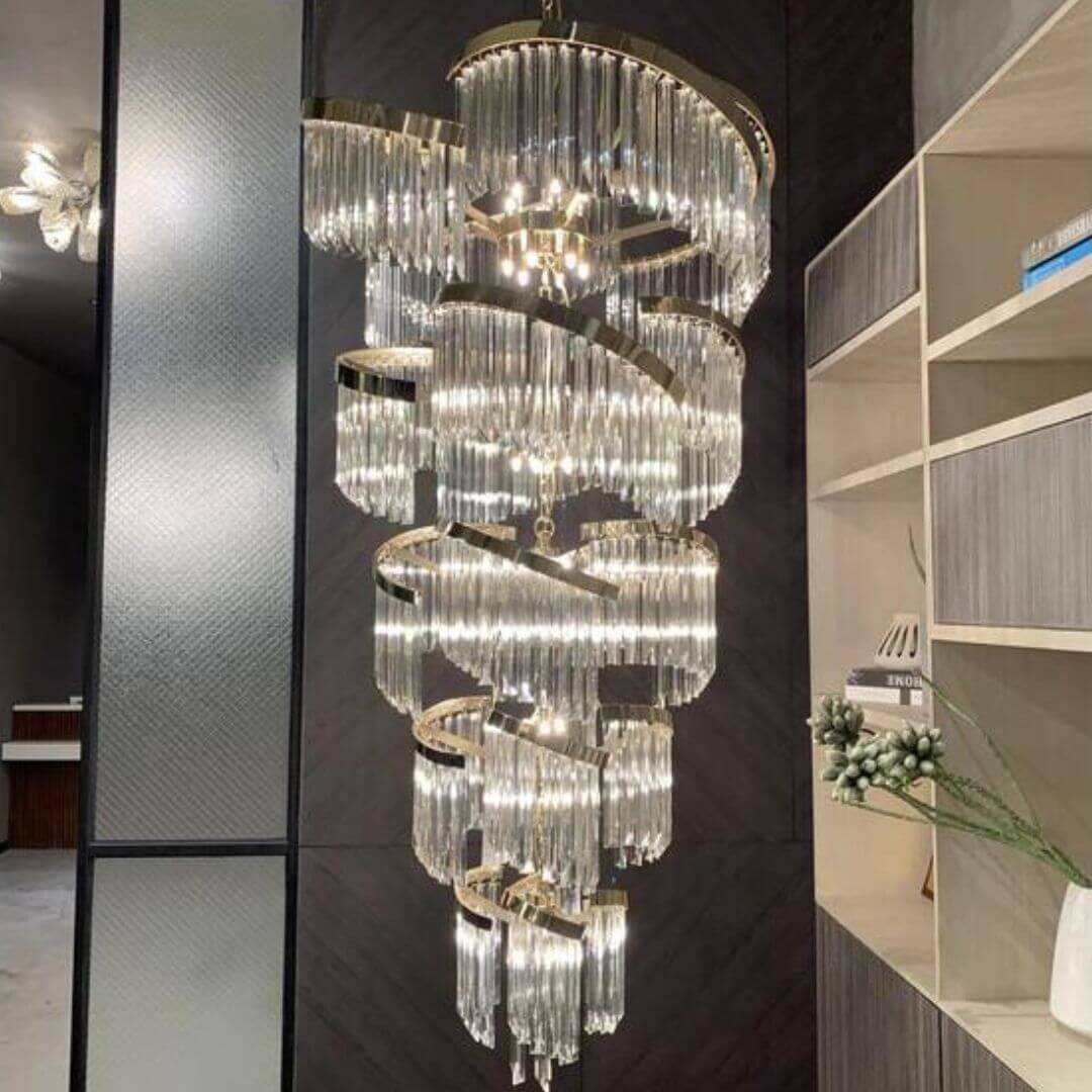 Luminary Glass Chandelier Light turned on, casting a warm, ambient glow through elegant glass shades, perfect for modern living spaces.