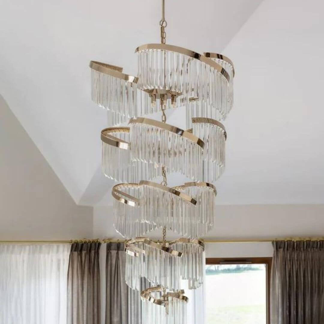 Luminary Glass Chandelier Light hanging gracefully, featuring sleek white-painted finish and elegant glass shades that provide soft ambient lighting