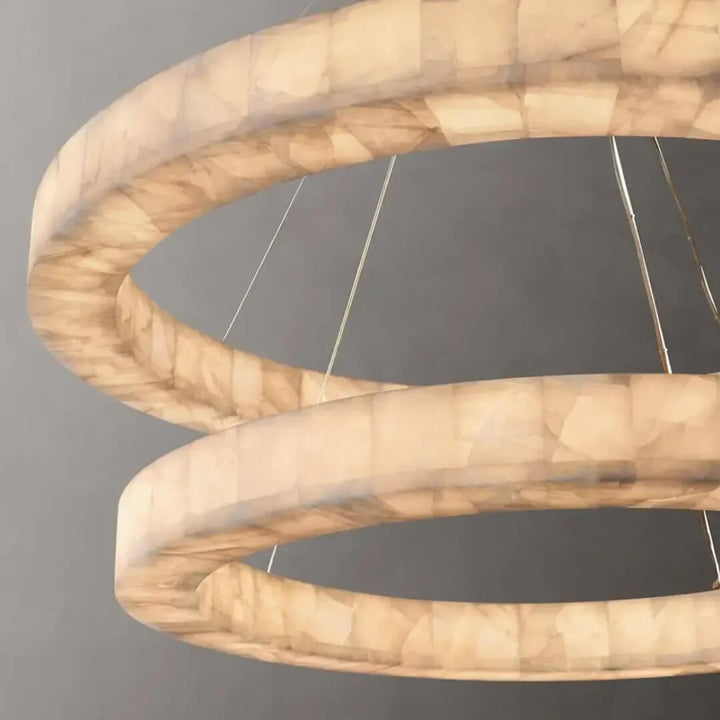Close-up view of Luna Circulo alabaster chandelier showcasing smooth alabaster shades and fine detailing.