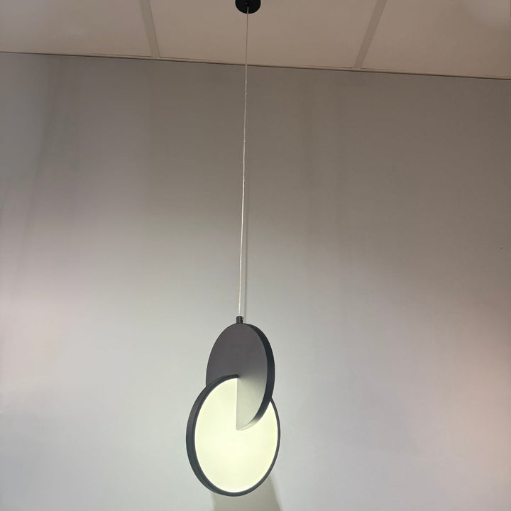 Luna Disc pendant light in black – modern circular hanging fixture with sleek matte finish.