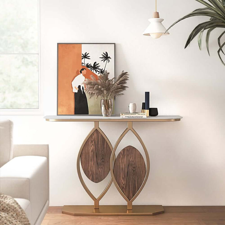 Luxury console table with leaf design, sintered stone top, and gold accents, showcasing elegant and modern style