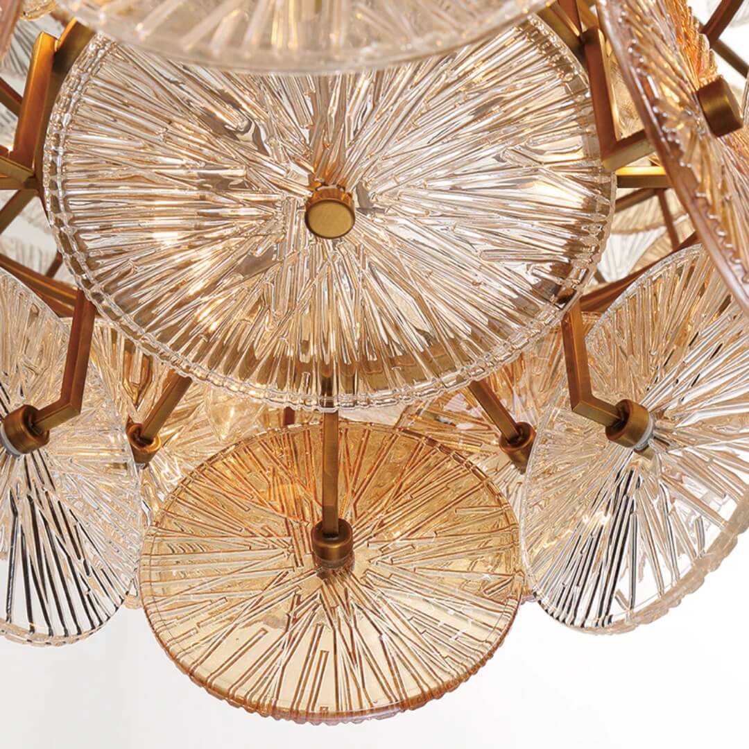 Front view of Luz de Sol Renato chandelier – elegant design with multiple light fixtures and gold finish.