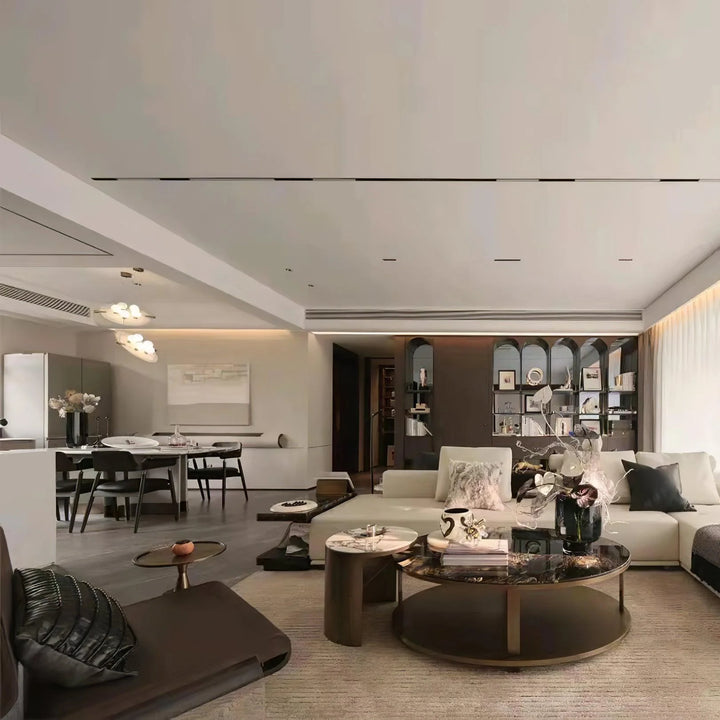 Front view of Magma pendant lamp with black exterior and glowing gold fiber interior, modern lighting