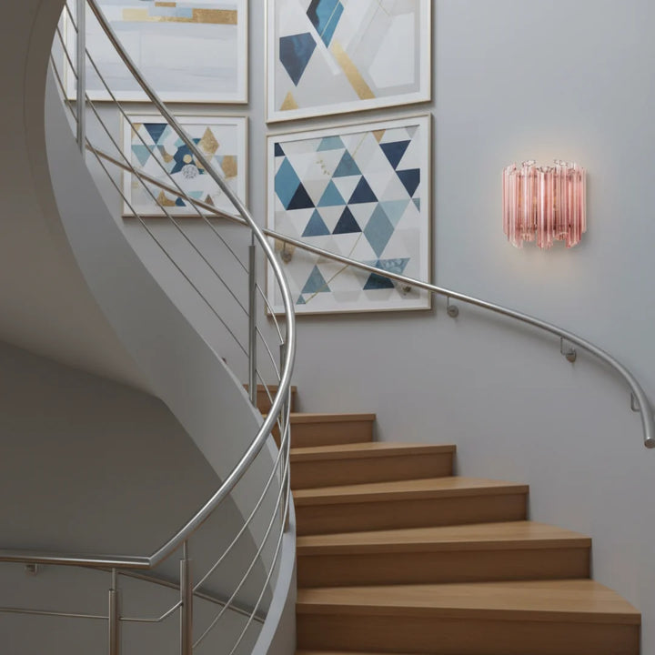 Massimo Picco modern glass wall light in a sleek stairside view, enhancing interior style