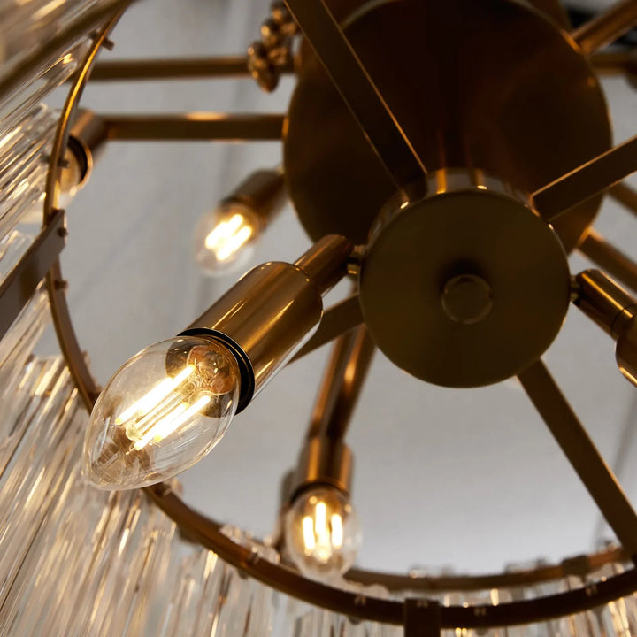 Massimo Round Glass Chandelier – Interior view showing metal frame and bulbs, highlighting the chandelier’s modern construction and design.