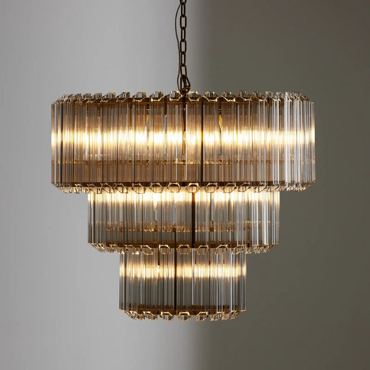 Massimo Round Glass Chandelier – Close-up view of the illuminated chandelier, highlighting its glass design and modern aesthetic