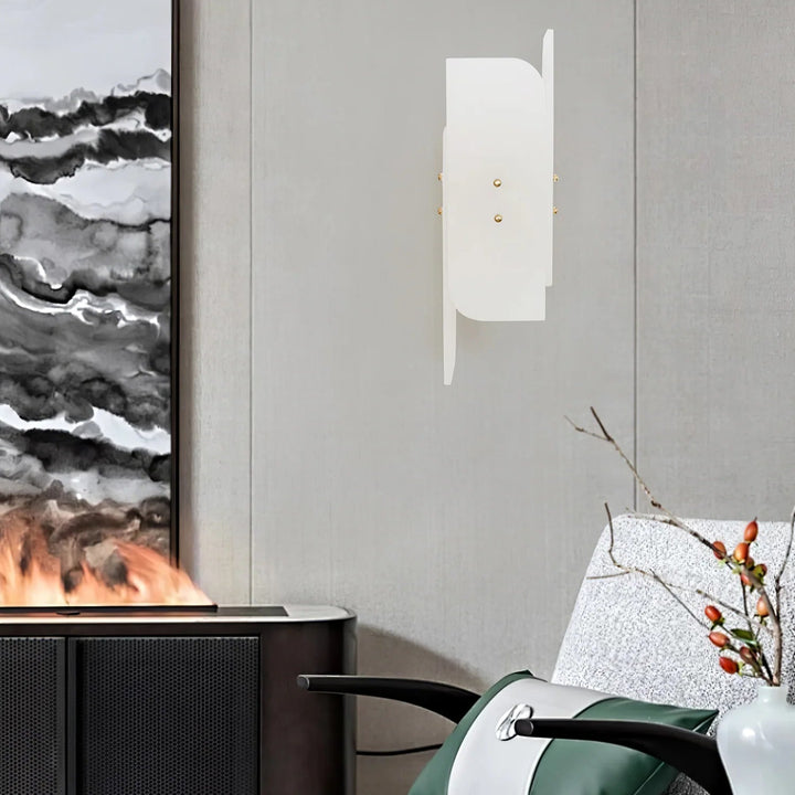 Megalith alabaster wall light side view in a living room showcasing luxury modern lighting for elegant interiors