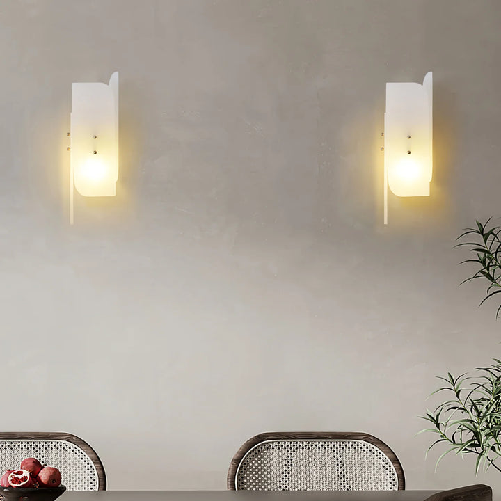 Megalith alabaster wall light on dining room wall showcasing luxury modern lighting for elegant interiors