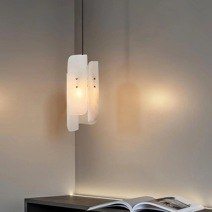 Front hanging view of Megalith Mini Pendant Light over table, modern lighting, luxury décor