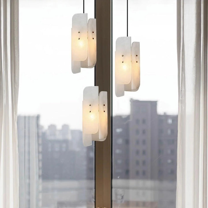 Living room hanging view of Megalith Mini Pendant Light with modern luxury lighting design