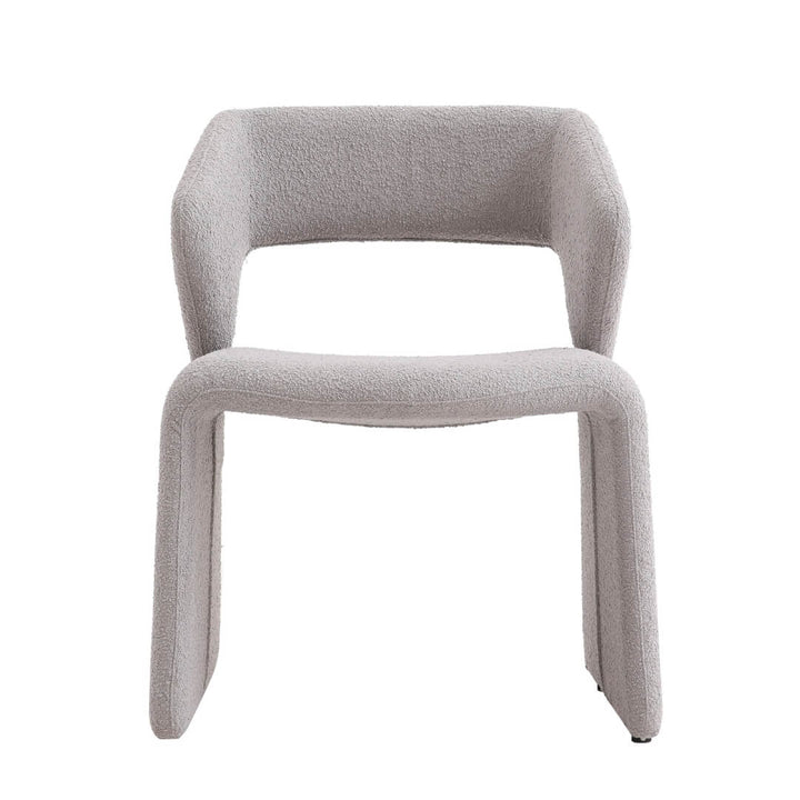 Modern beige curved dining chair with plush upholstery – stylish seating for contemporary dining areas.