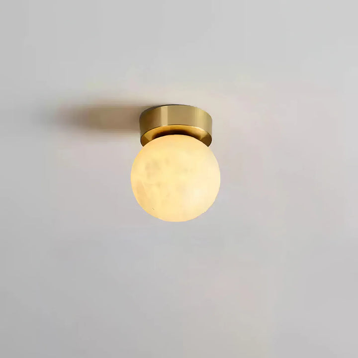 Front view of moon alabaster ceiling light with light on for modern home décor lighting