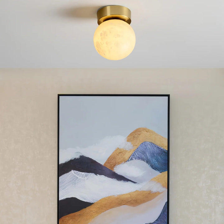 Front view of moon alabaster ceiling light with light on for modern home décor lighting