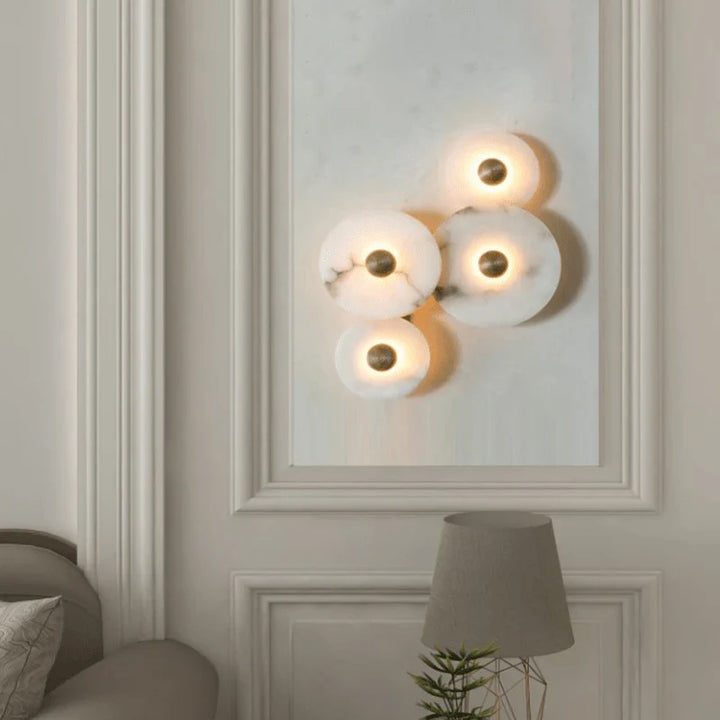 Nayra round alabaster wall lamp, modern lighting, living room view, four sizes