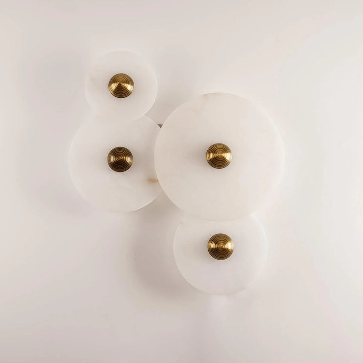 Nayra round alabaster wall lamp, modern lighting, front view, four sizes