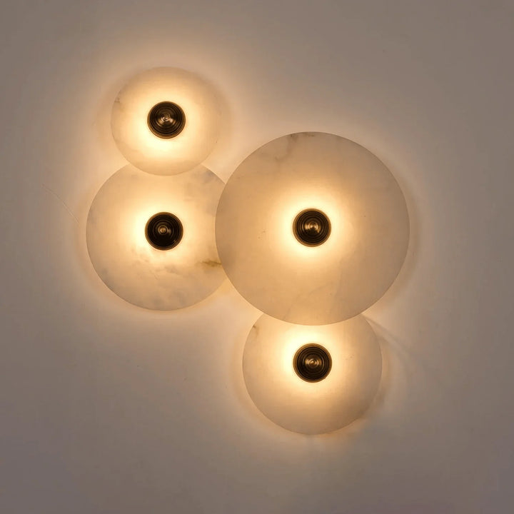 Nayra round alabaster wall lamp, modern lighting, front view for home décor
