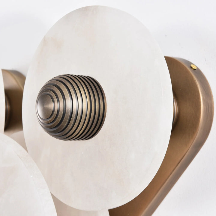 Nayra round alabaster wall lamp, modern lighting, side view for stylish décor