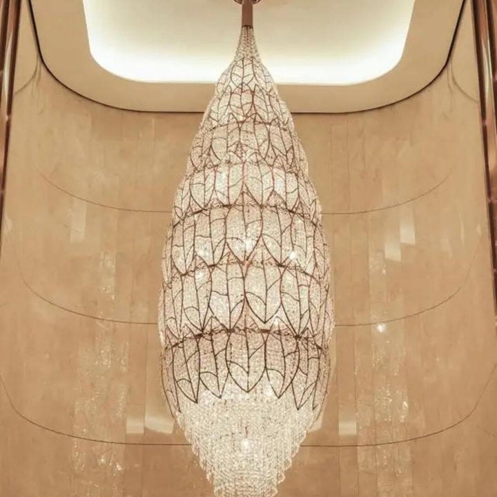Front view of neon oval-shaped chandelier light, showcasing sleek design and bright vibrant glow