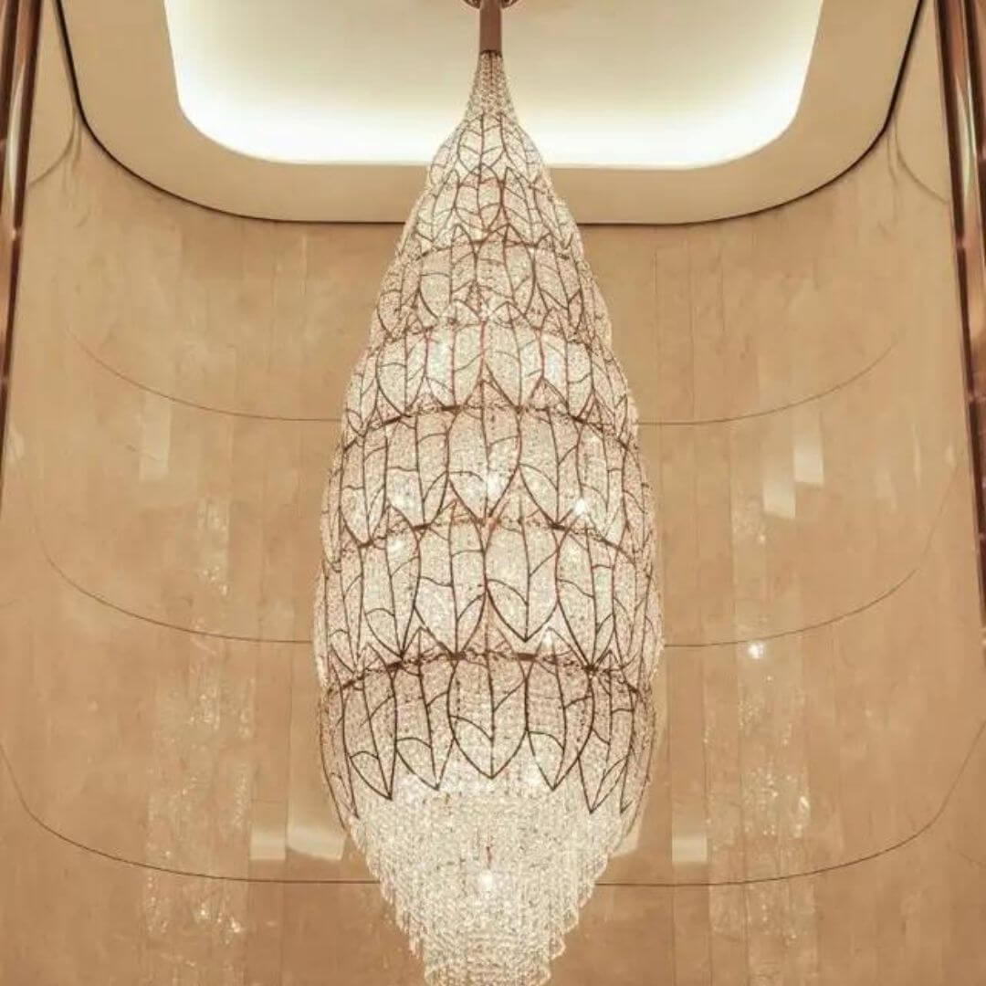 Front view of neon oval-shaped chandelier light, showcasing sleek design and bright vibrant glow