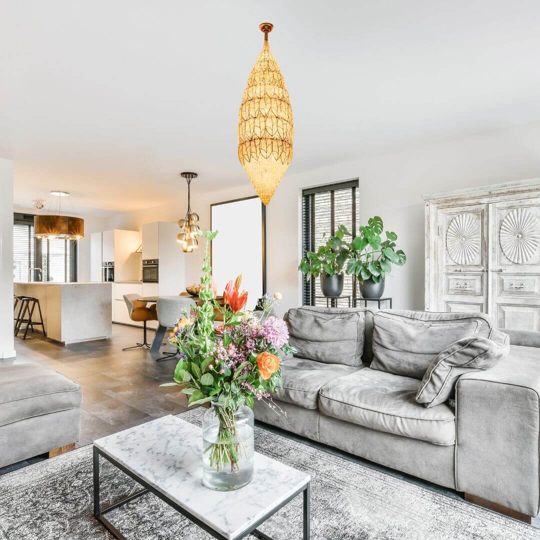Neon oval-shaped chandelier light in living room, creating a modern and vibrant ambiance with stylish glow