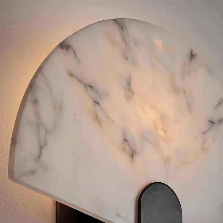 Nevora alabaster wall lamp detailed view showing fan-shaped marble and gold metal accents, elegant design