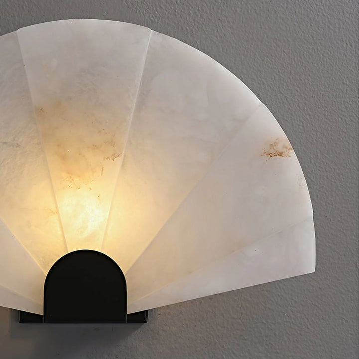 Nevora alabaster wall lamp detailed view showing alabaster shade and gold metal accents, elegant design