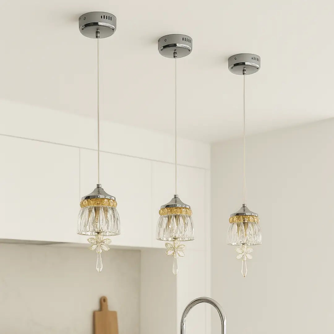 Nova crystal chrome pendant light hanging above kitchen island – elegant and modern interior design