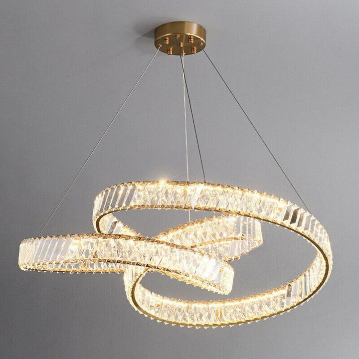 Nova Crystal LED Twisted Chandelier Light turned on in warm mode, emitting a cozy glow with elegant postmodern charm
