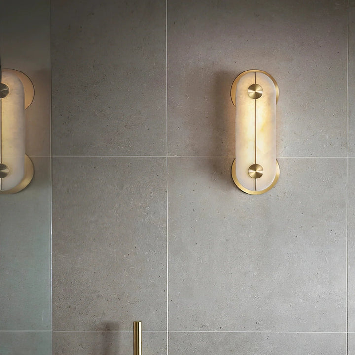 Obvara alabaster wall light front view with gold metal accents, modern and elegant lighting fixture