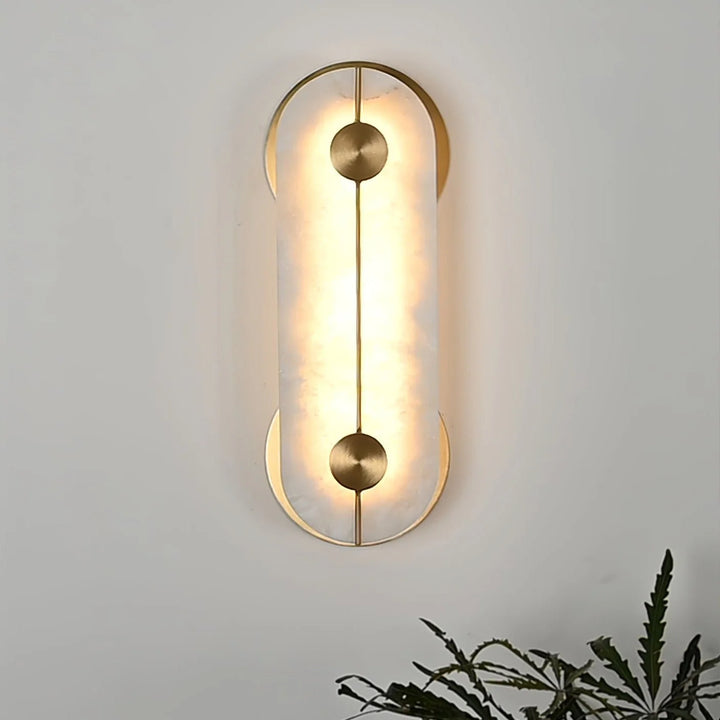 Obvara alabaster wall light front view featuring gold metal accents, modern elegant lighting design