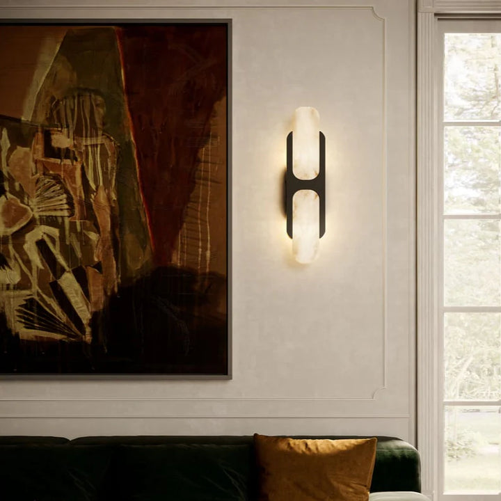 Odin wall sconce modern lighting on living room wall, stylish finish enhancing interior décor