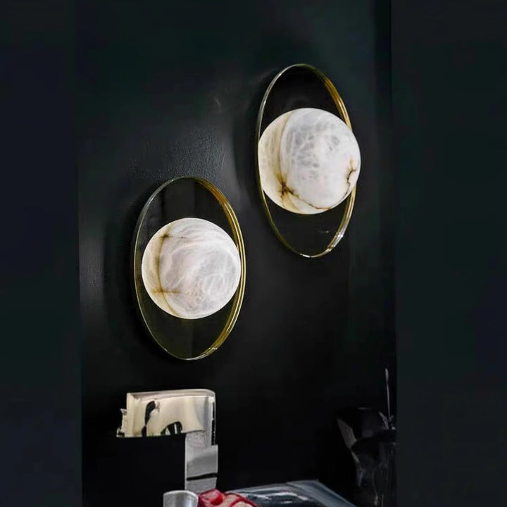 Ophela alabaster sconce side view of metal plate on half marble, modern elegant wall light