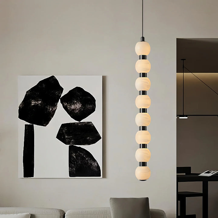 Orbique alabaster pendant lamp modern lighting enhancing a living room with elegant contemporary design